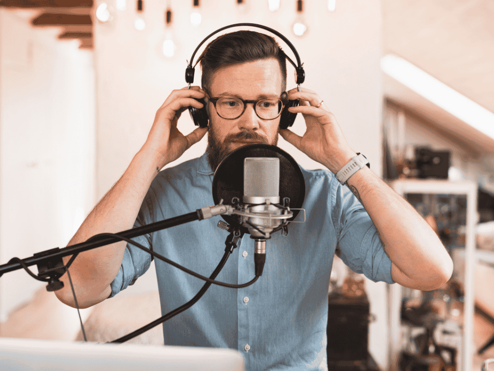 A man doing a podcast using a podcast microphone