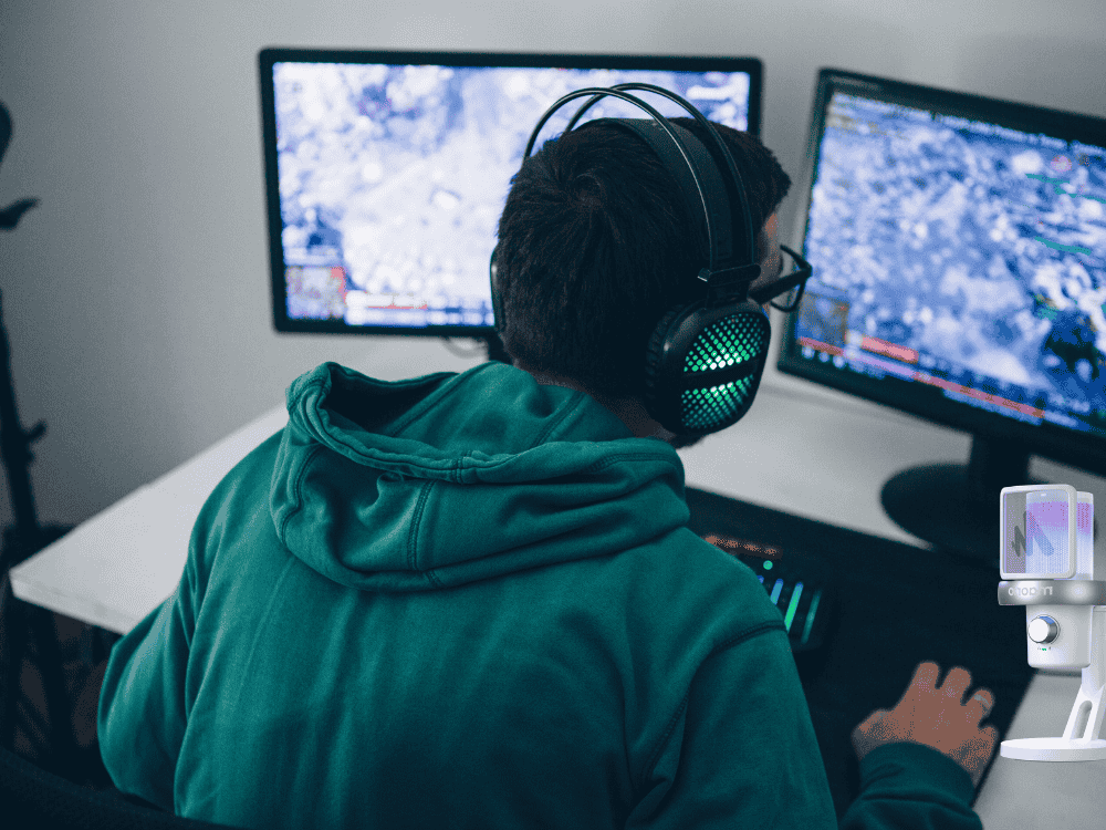 A man streaming his game live with a gaming microphone