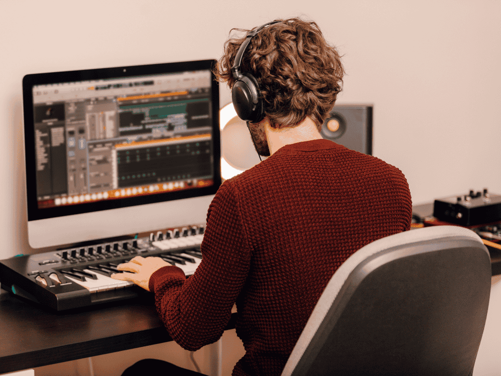 male recording music using an audio interface