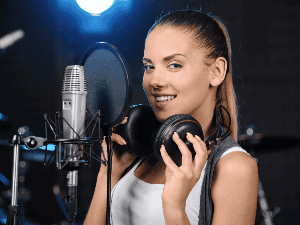 a lady music recording in studio using an xlr microphone