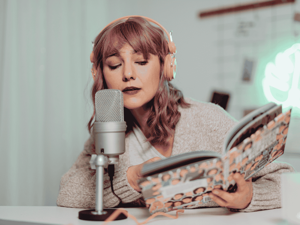 A female voice over artist using a voice over microphone