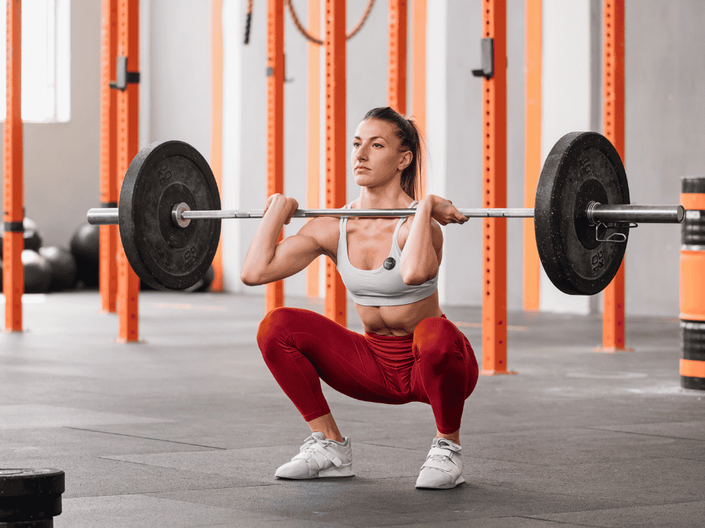 A lady documenting her weightlifting workout using a wireless microphone