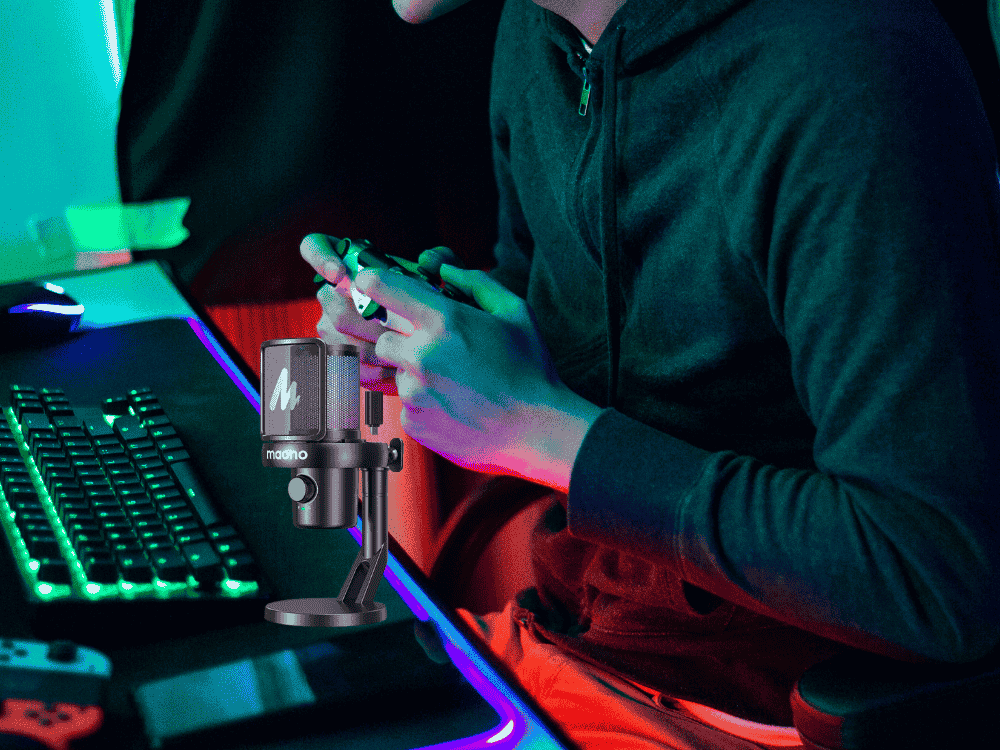 A male gamer streaming Mobile Legends game play using a gaming microphone