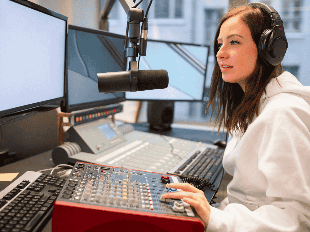A woman podcasting using a dynamic microphone