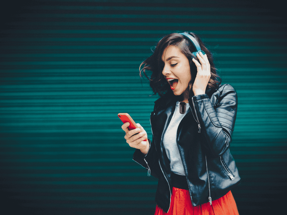 A Gen Z woman creating content using a wireless microphone