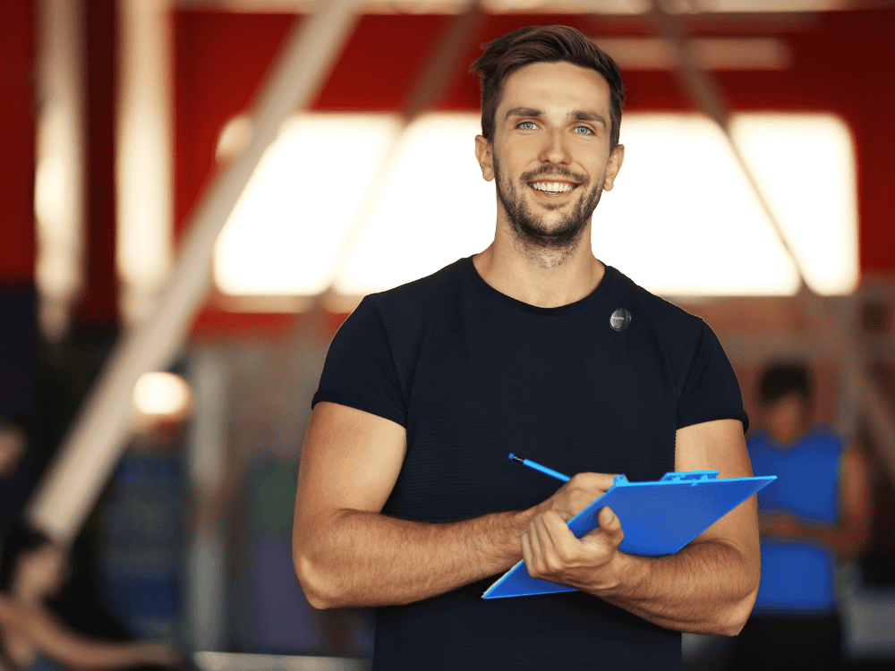 A male trainer discussing fitness topic in his vlog using wireless microphone