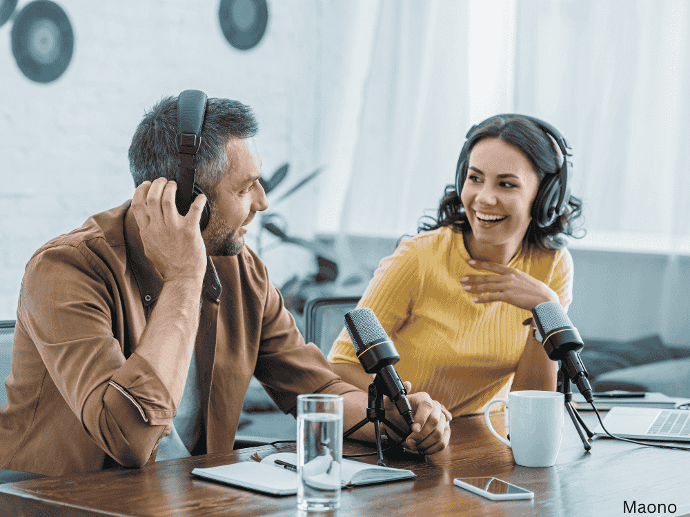2 people podcast recording in studio using a cardioid microphone
