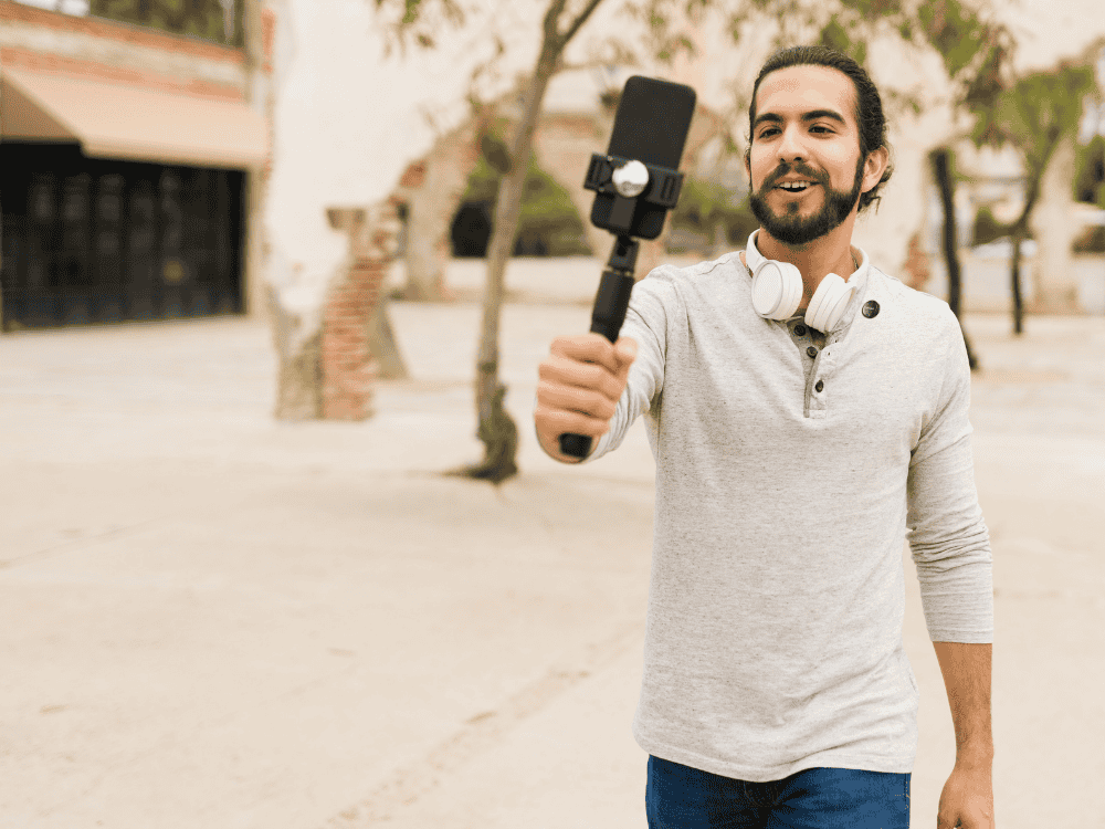 a travel vlogger using a wireless microphone and smartphone for content