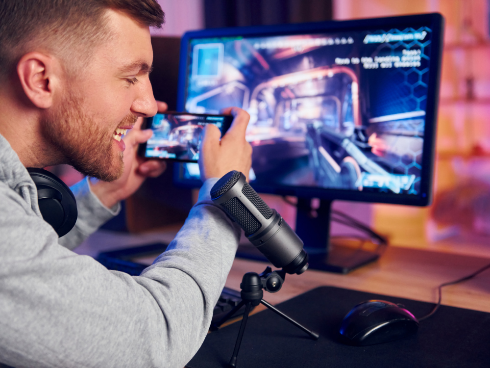 a male gamer using DM40 Pro, the best USB microphone for gaming in 2025 