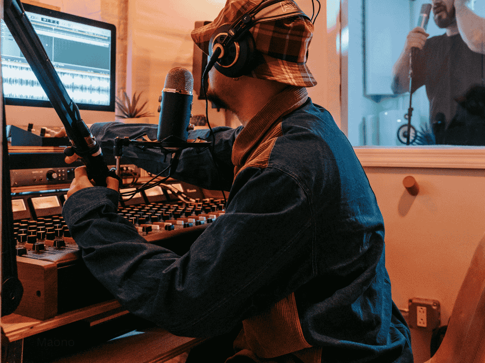 men recording in studio using condenser microphones