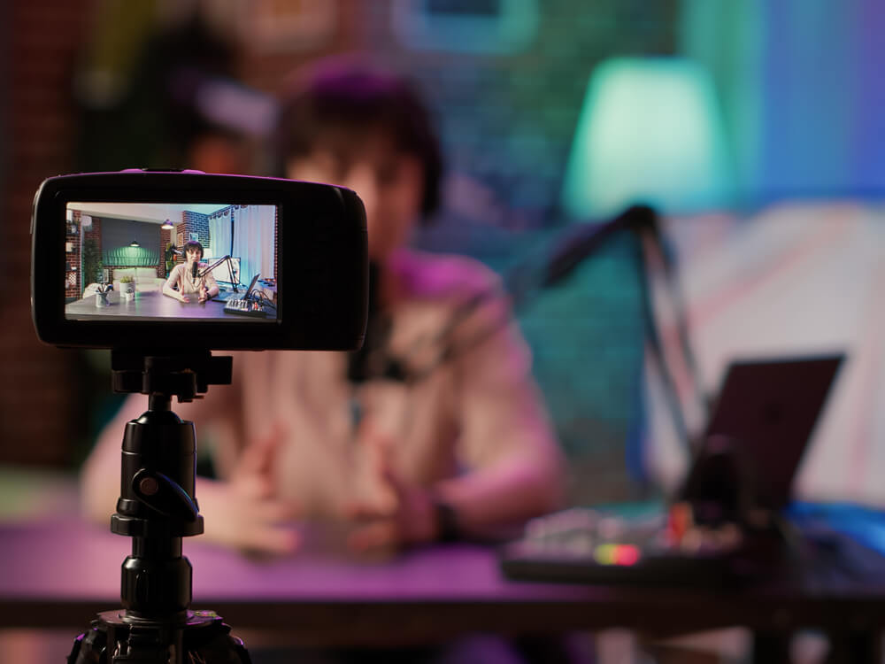 a person using a video recorder microphone
